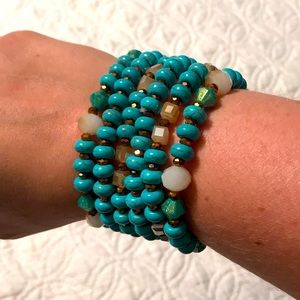 Turquoise colored bracelets with decorative beads